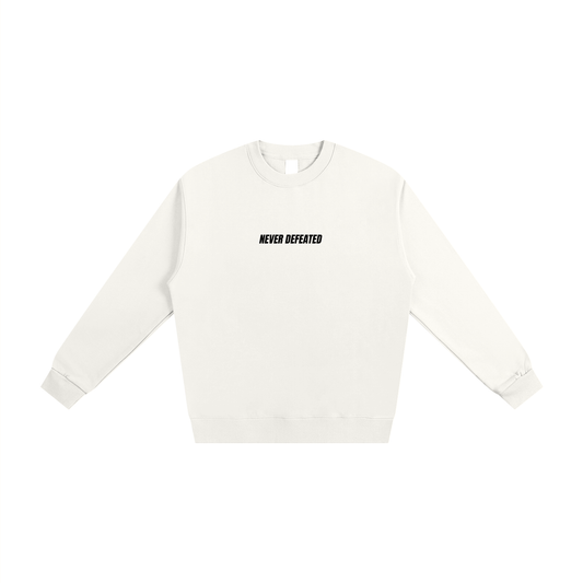 NEVER DEFEATED HEAVYWEIGHT SWEATSHIRT ‘WHITE’