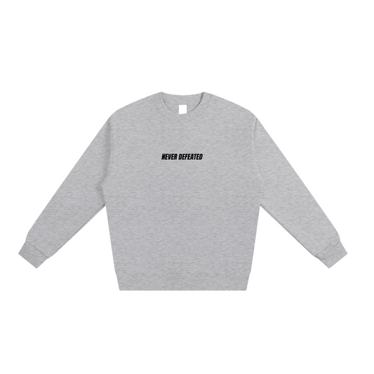NEVER DEFEATED HEAVYWEIGHT SWEATSHIRT ‘GRAY’